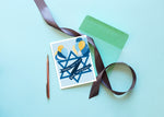 A Bar Mitzvah card in light blue, with a yellow and blue Star of David and matching balloons. It reads "Mazel Tov on your Bar Mitzvah" in an elegant font.