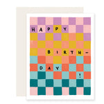 A vibrant and colorful birthday card with a playful checkerboard pattern in a rainbow of hues. The card reads 'Happy Birthday,' creating a joyful and celebratory visual.