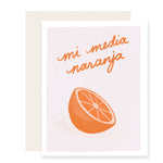 A charming love card featuring an adorably illustrated orange half with the phrase 'Mi media naranja,' perfect for expressing affection to a friend or partner.