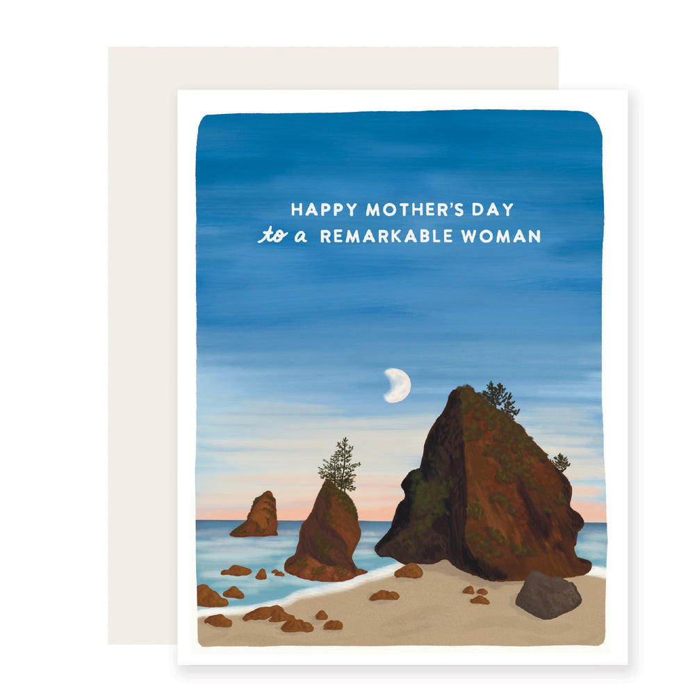  A breathtaking Mother's Day card featuring an illustration of a serene coastal shore with towering rocks and a moon rising in the background, accompanied by the text 'Happy Mother's Day to a remarkable woman'. 
