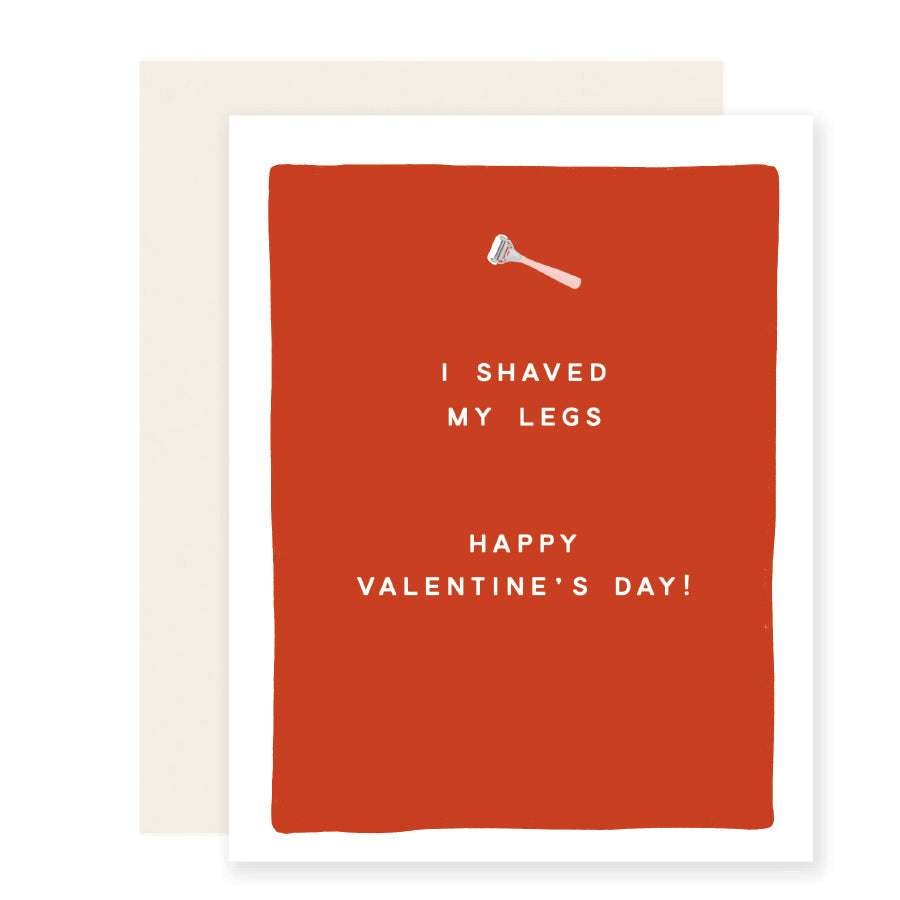 Playful Valentine's card with a red background, small type, and a tiny razor illustration. Message reads: 'I shaved my legs. Happy Valentine's Day.' A humorous and charming expression of love.