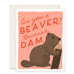 A playful and humorous love card with a beautifully illustrated, adorable beaver gnawing on a piece of wood. The card's witty message reads, Are you a beaver? Because dam, adding a light-hearted touch to the sentiment.