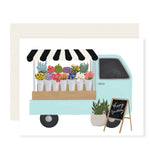 Charmingly illustrated card depicting a delightful truck selling vibrant flowers, with the message 'Happy Birthday'—perfect for expressing love and sharing joy with your special someone on their special day.