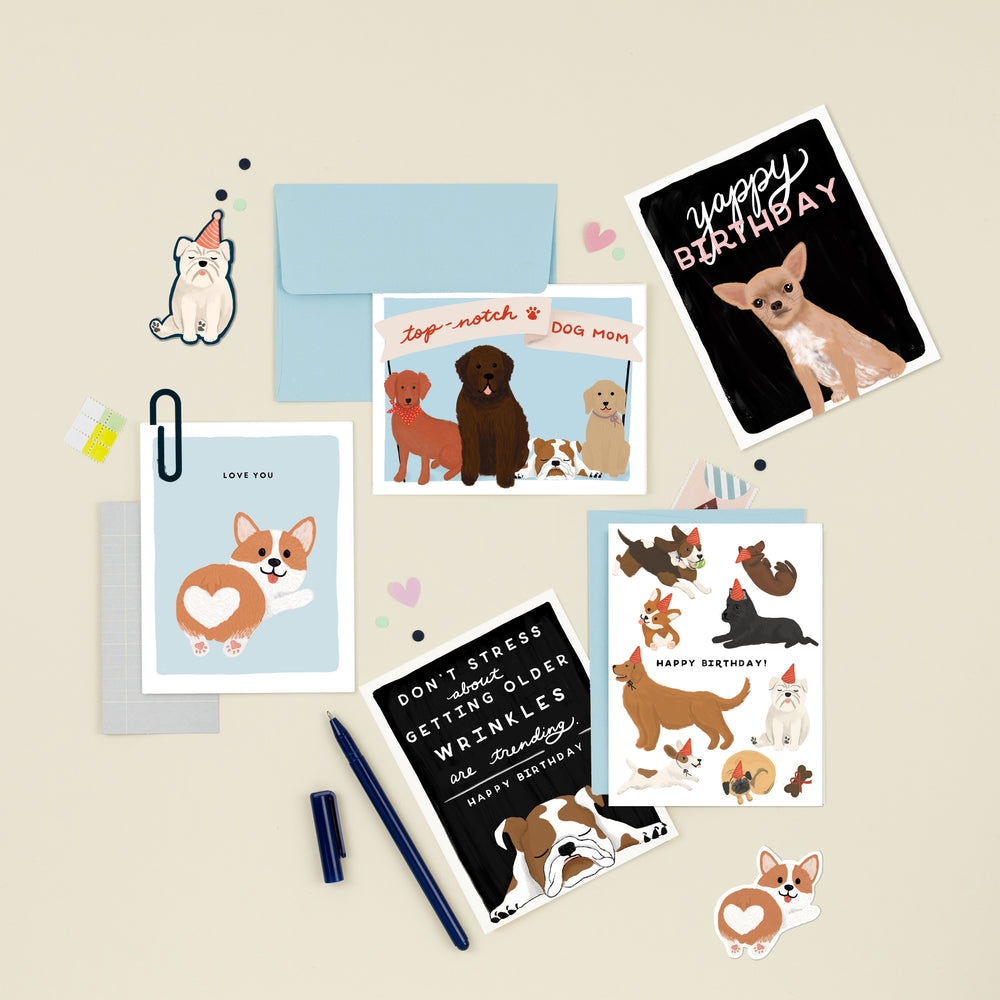 A delightful collection of illustrated cards for various occasions, featuring a charming assortment of dogs. Perfect for dog lovers, these cards offer a range of heartwarming designs