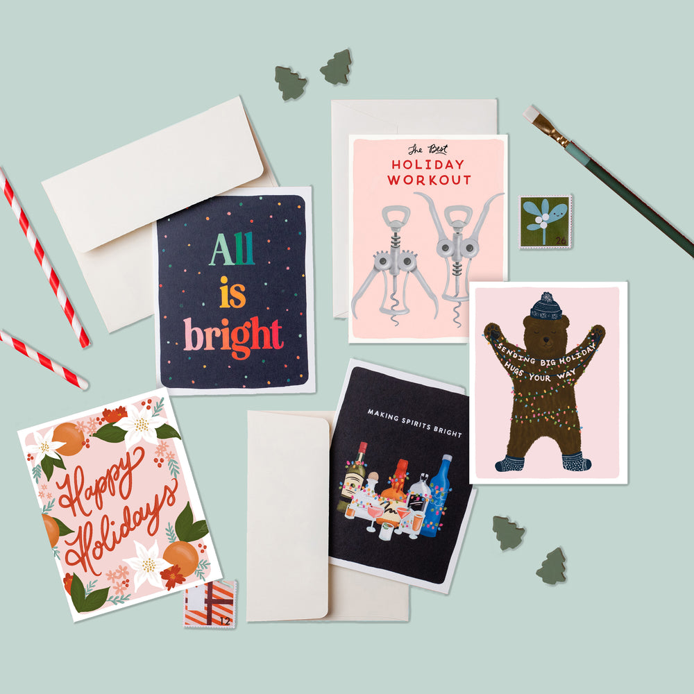 A delightful assortment of beautifully illustrated Christmas cards, offering a range of sentiments from simple and elegant holiday wishes to witty and punny greetings, catering to a variety of tastes and holiday moods.