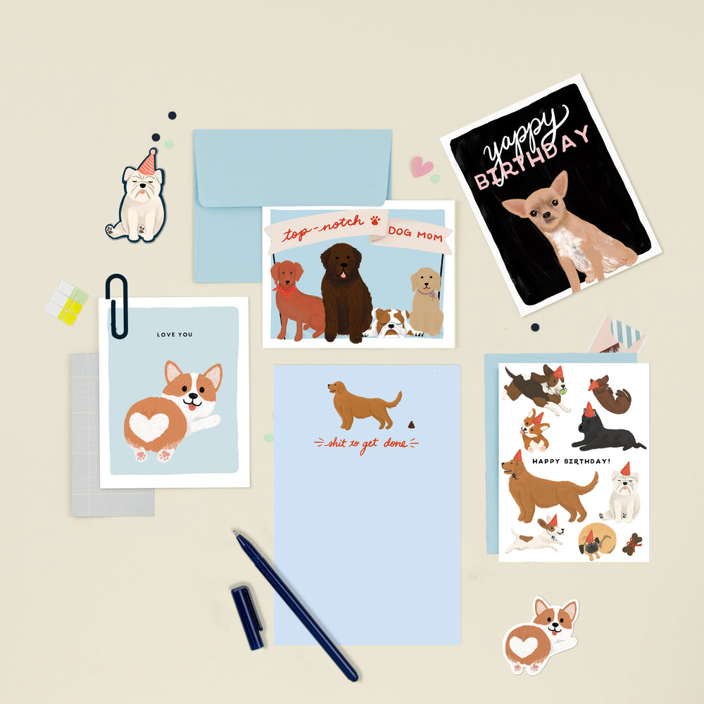A delightful collection of illustrated cards and notepads for various occasions, featuring a charming assortment of dogs. Perfect for dog lovers, these cards offer a range of heartwarming designs