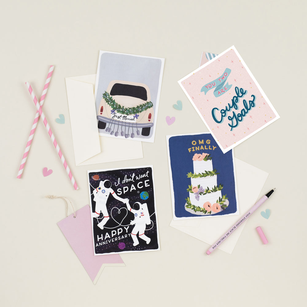 A variety of beautifully illustrated wedding and anniversary cards, ranging from simple and elegant to bright and bold, all conveying heartfelt best wishes to the newlyweds.