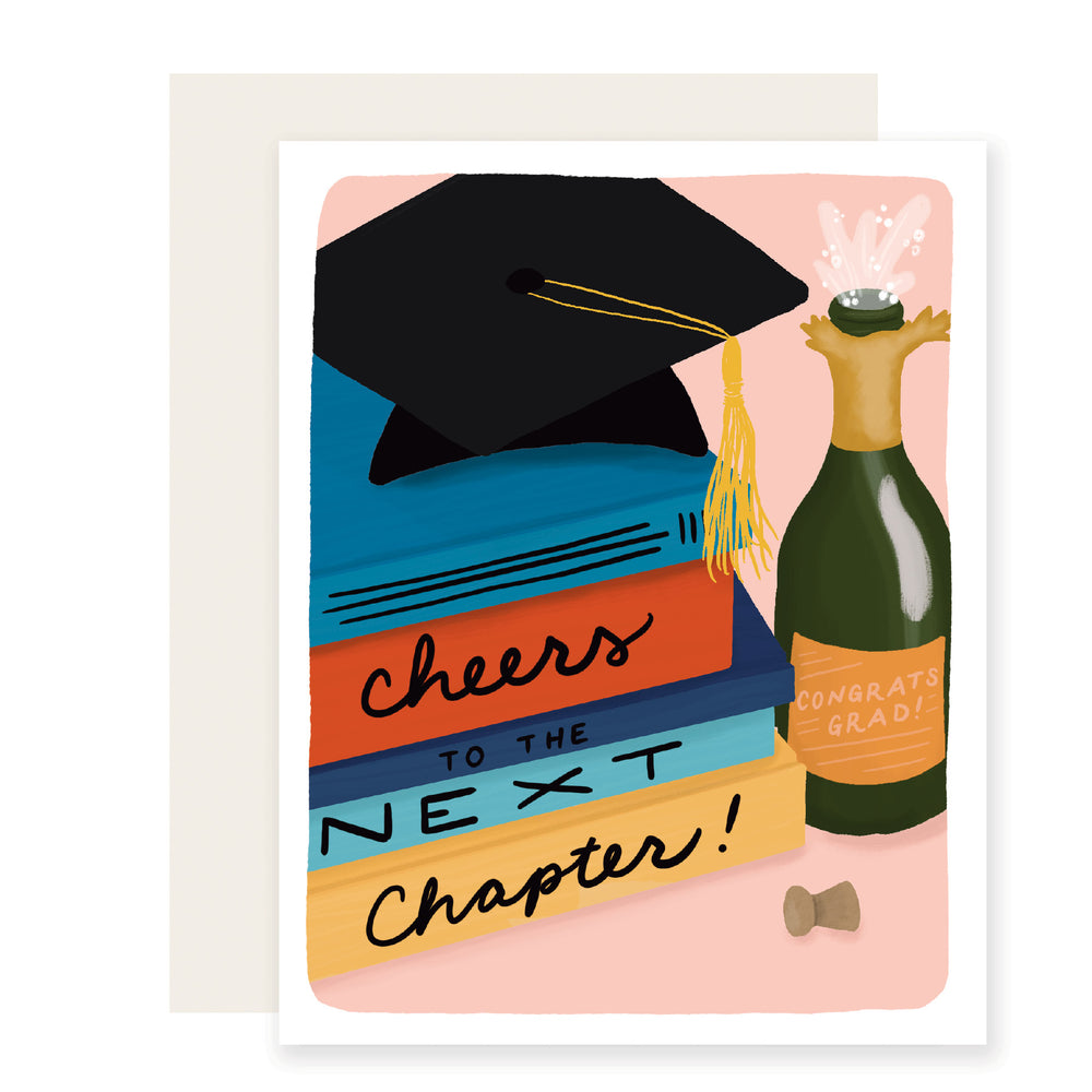 A graduation card with vibrant illustrations of a bottle of champagne next to a stack of colorful books, with a graduation cap on top of the books. The spines of the books read 'Cheers to the next chapter.