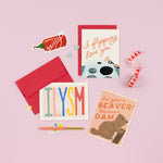 A diverse collection of beautifully illustrated love cards, ranging from playful to heartwarming, perfect for expressing love and catering to various emotions