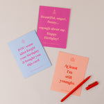 A collection of colorful, humorous cards featuring cheeky messages for all occasions, including birthdays, congratulations, Christmas, and new moms, adding a delightful twist of laughter.