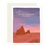 An exquisite card with a heartfelt message: You're a remarkable human being. The card features a stunning gradient sky transitioning from purples to pinks, complemented by elegant sandstone hues, creating a sense of admiration and appreciation.