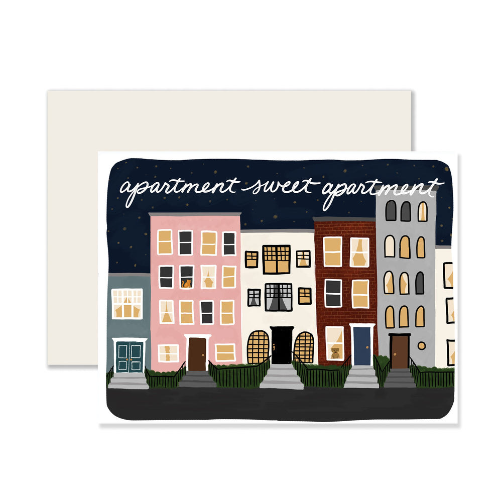 A delightful housewarming card with an illustration of various brownstone apartments. The card's message reads 'Apartment Sweet Apartment,' welcoming someone to their new home with warmth and charm.