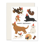 Charming birthday card for dog lovers featuring an adorable assortment of illustrated dogs wearing birthday hats, conveying warm wishes with 'Happy Birthday' message.