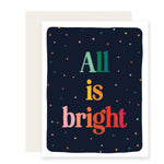 A boldly illustrated holiday card with a dark background and a gradient text from greens to reds, adorned with a spectrum of bright and vibrant colors. The card reads 'All is bright,' conveying a festive and vivid holiday message.