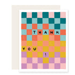 A vibrant and colorful thank you card with a playful checkerboard pattern in a rainbow of hues. The card reads 'Thank You,' creating a joyful and celebratory visual.