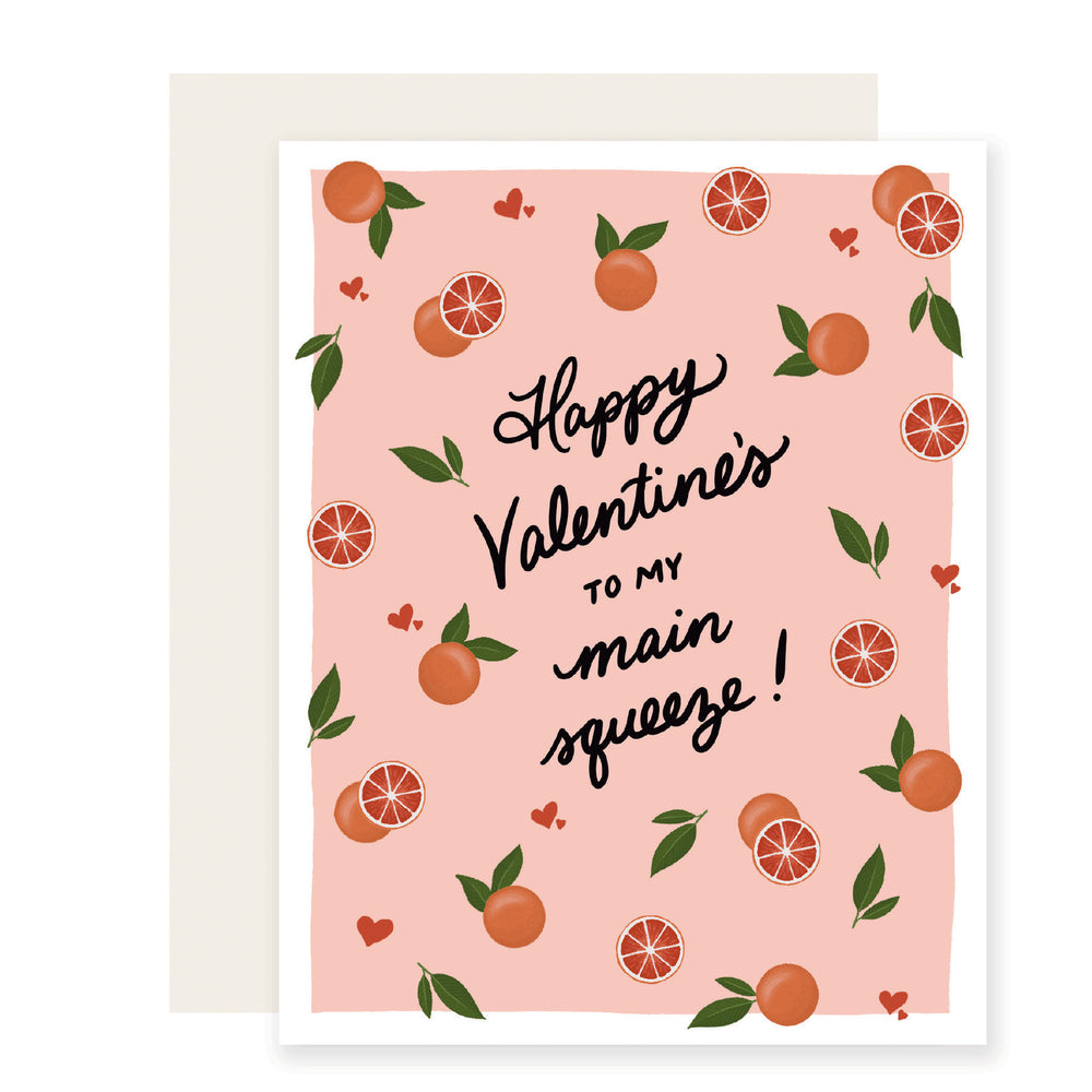 A charming Valentine's Day card that reads 'Happy Valentine's Day to my main squeeze.' The card features delightful illustrations of oranges and hearts! 