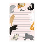 A pink notepad with lines, bordered by adorable illustrations of a variety of cats.The notepad is the ideal spot for your brilliant ideas and feline-friendly notes, making it the purr-fect stationery for cat lovers.