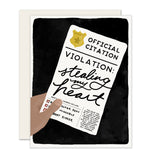  A charming love card with the text 'Official Citation. Violation: Stealing My Heart'The card features a playful design, capturing the sentiment of affection and humor. 