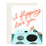 Heartwarming card featuring an adorable illustration of a stove with a skillet, a hand flipping a pancake, and the message 'I flippin' love you.' A fun and playful way to express affection with a touch of warmth and humor.