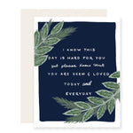 A sympathy card featuring elegantly illustrated green leaves with a heartfelt message that reads 'I know this day is hard for you, but please know that you are seen and loved today and every day.